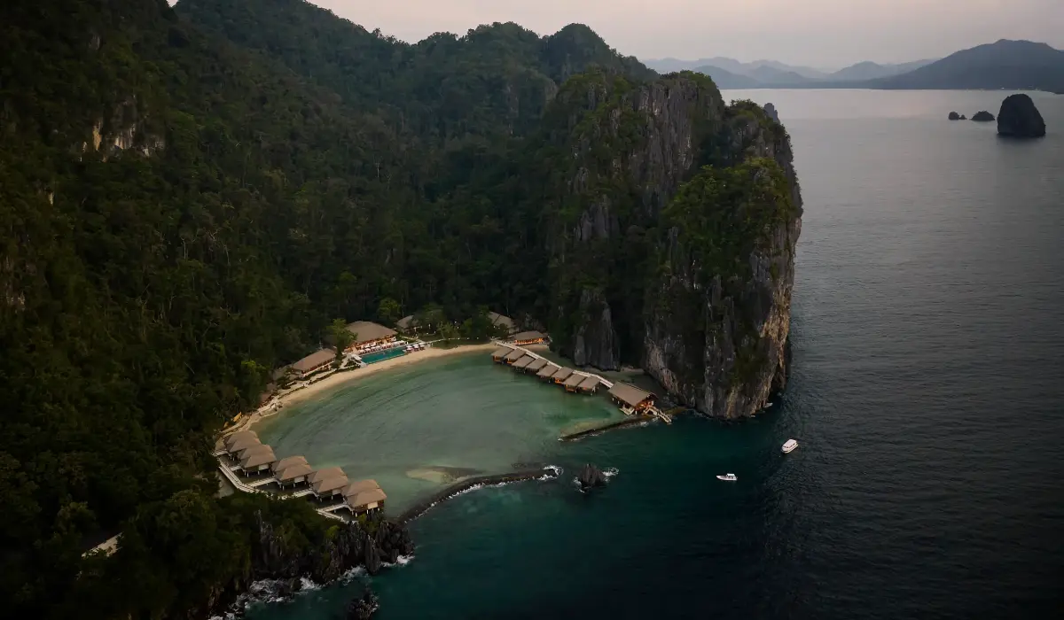 Aerial view of a sheltered cove surrounded by evergreen forest